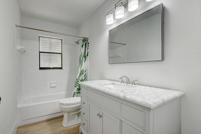 bathroom with shower / bath combo with shower curtain, vanity, toilet, and wood finished floors