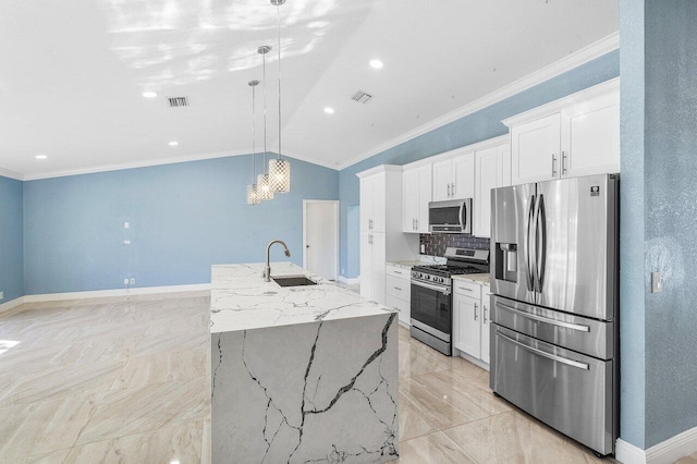 kitchen with appliances with stainless steel finishes, visible vents, a sink, and crown molding