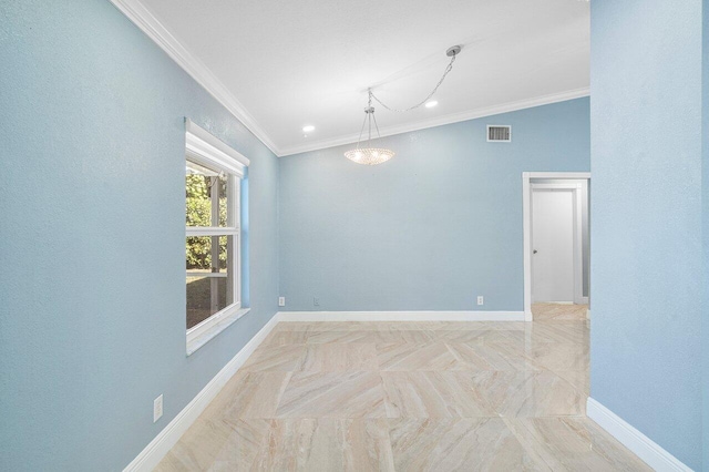 spare room with ornamental molding, visible vents, and baseboards