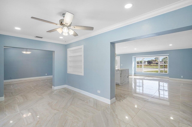 empty room with visible vents, ornamental molding, a ceiling fan, and baseboards