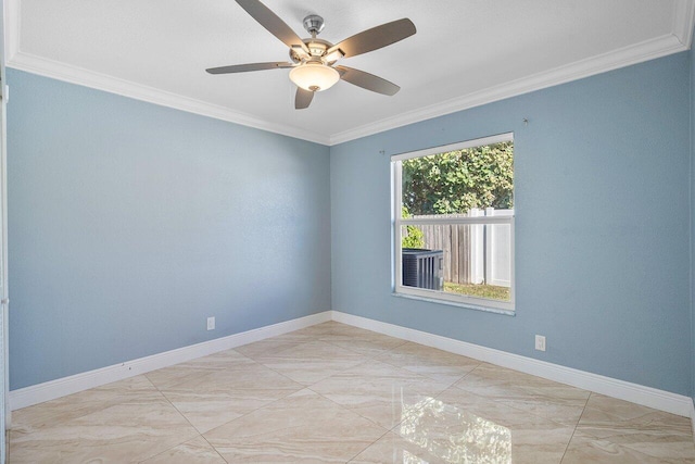 spare room with baseboards, ceiling fan, and crown molding