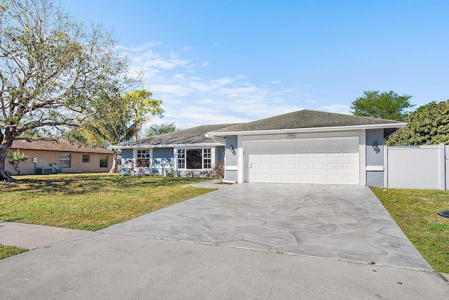 ranch-style home with a garage, driveway, a front lawn, and stucco siding