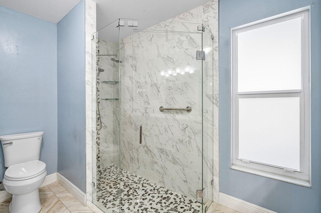 full bath with toilet, marble finish floor, a marble finish shower, and baseboards