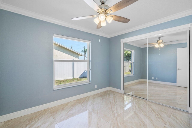 unfurnished bedroom with crown molding and baseboards