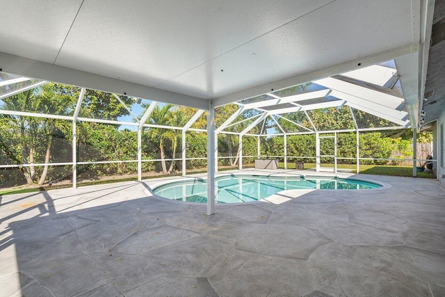 outdoor pool with a lanai and a patio