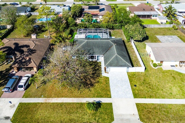 birds eye view of property with a residential view