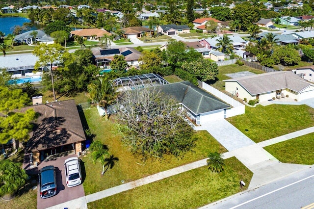 aerial view with a residential view and a water view