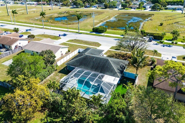 drone / aerial view with a residential view and a water view