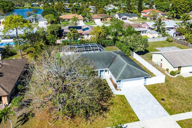 bird's eye view featuring a residential view and a water view