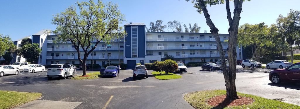 view of property with uncovered parking