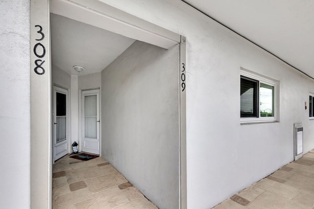 entrance to property with stucco siding