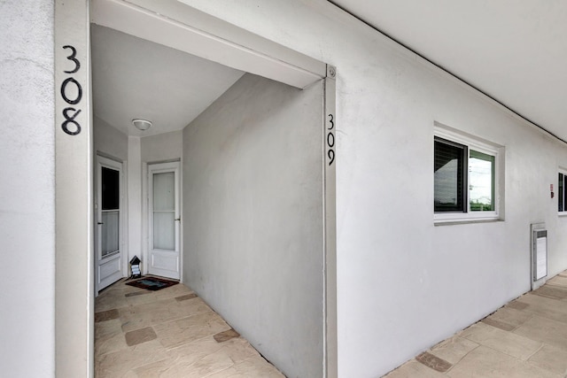 2936 Lake Shore Dr Unit 309, Riviera Beach, FL 33404 - view of exterior entry with stucco siding