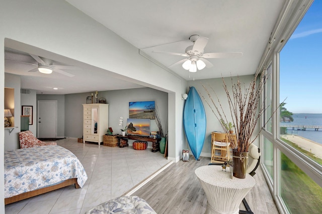 bedroom with visible vents, tile patterned floors, a ceiling fan, and baseboards