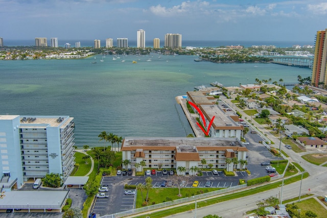 aerial view featuring a view of city and a water view