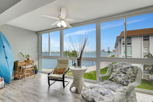 2936 Lake Shore Dr Unit 309, Riviera Beach, FL 33404 - sunroom with a water view and a ceiling fan