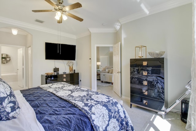 bedroom with arched walkways, light colored carpet, visible vents, baseboards, and ornamental molding