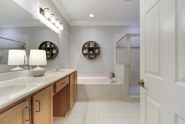 full bathroom featuring ornamental molding, a stall shower, a sink, and tile patterned floors