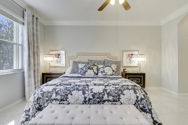 bedroom featuring tile patterned flooring, crown molding, baseboards, and ceiling fan