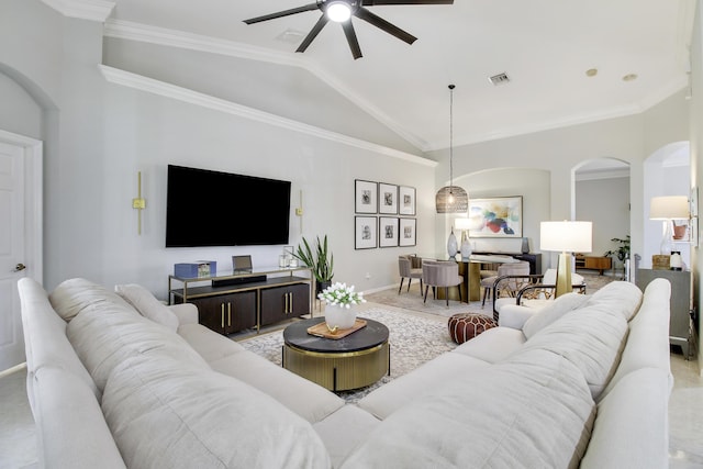 living room with crown molding, arched walkways, visible vents, and vaulted ceiling