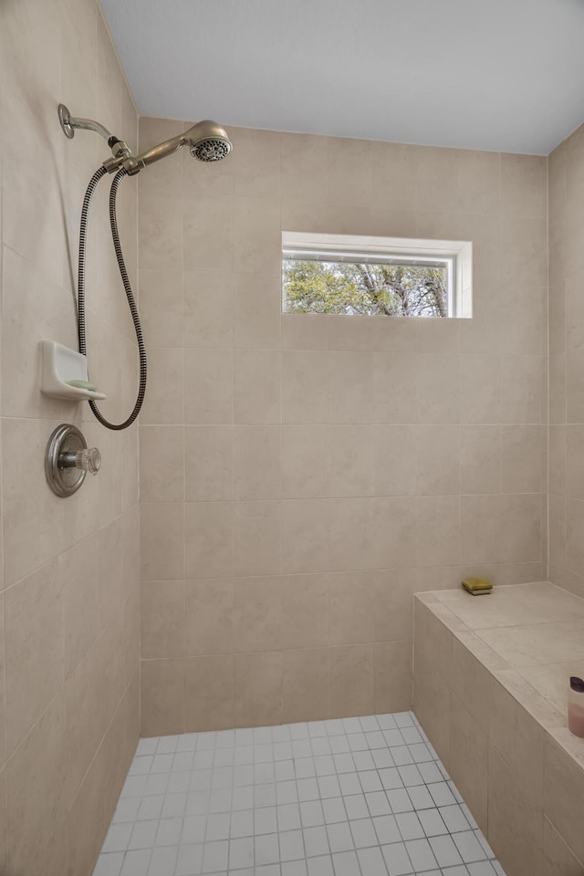 full bathroom featuring tiled shower