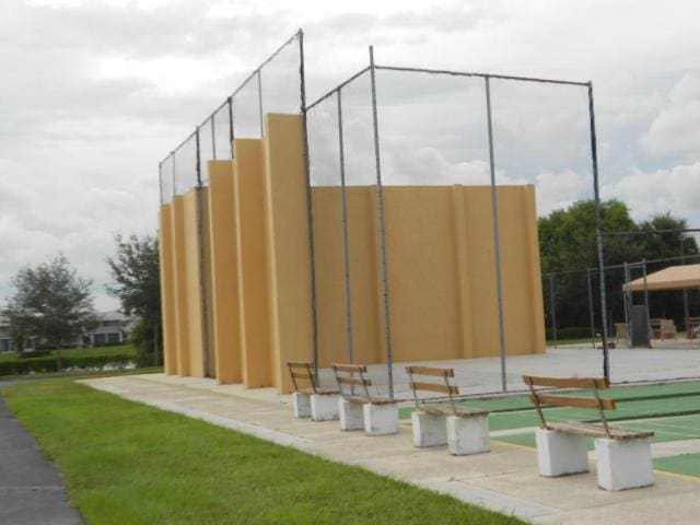 view of community featuring fence