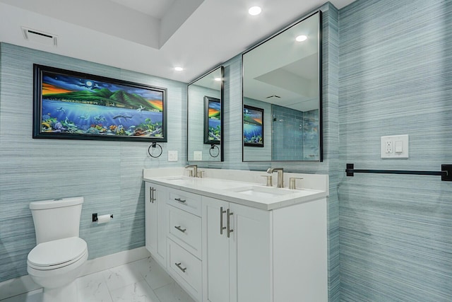 full bath featuring toilet, marble finish floor, a sink, and visible vents