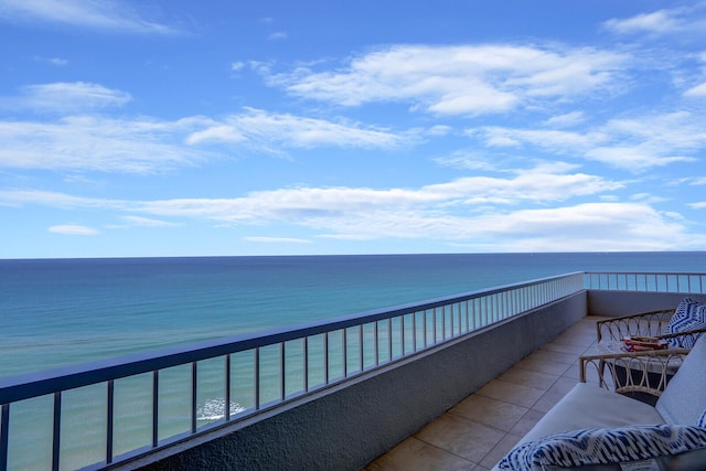 balcony featuring a water view