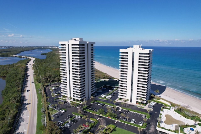 aerial view featuring a water view and a view of the beach