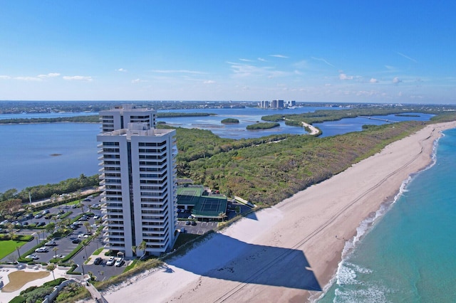 bird's eye view with a water view and a view of the beach