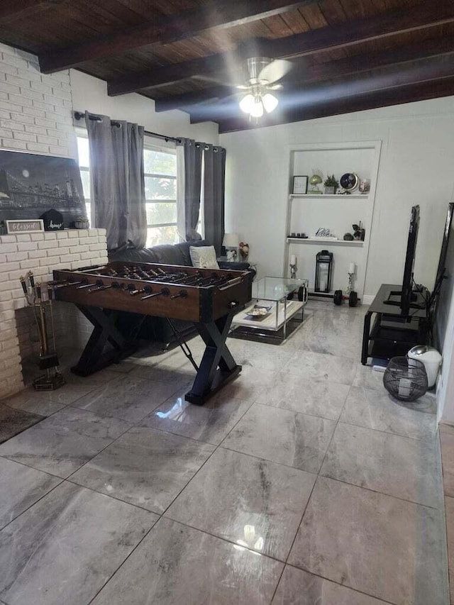 game room featuring beamed ceiling and wooden ceiling