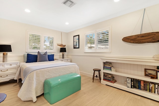 bedroom featuring recessed lighting, visible vents, multiple windows, and wood finished floors