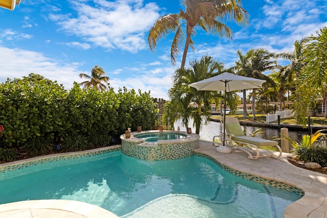 view of swimming pool with a pool with connected hot tub