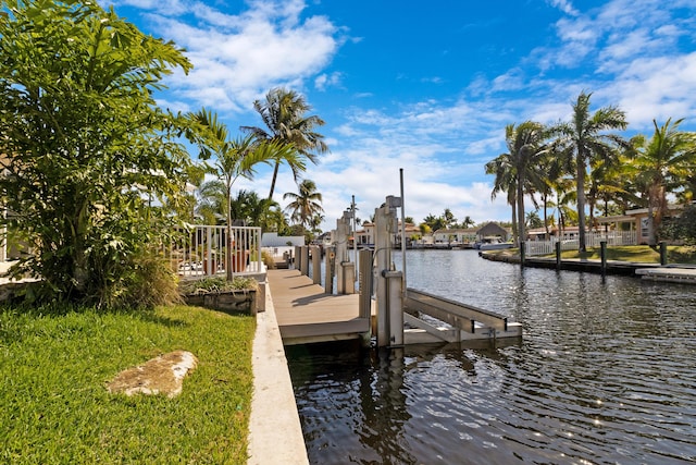 view of dock with a water view and boat lift