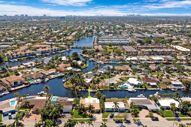 drone / aerial view with a residential view and a water view