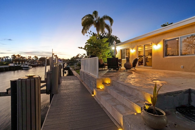 exterior space featuring a patio area and a boat dock