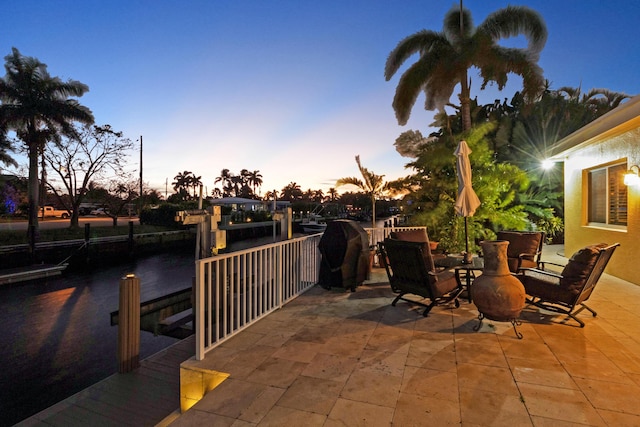 patio terrace at dusk with area for grilling