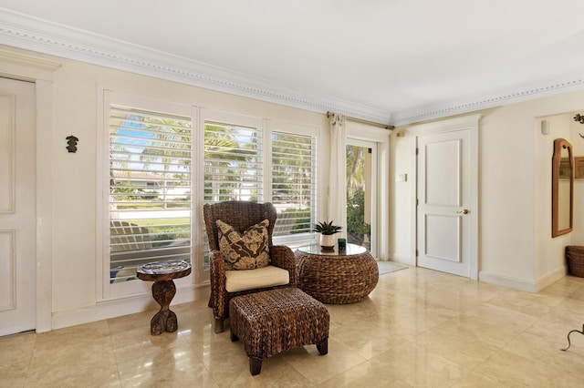 sitting room featuring baseboards and ornamental molding