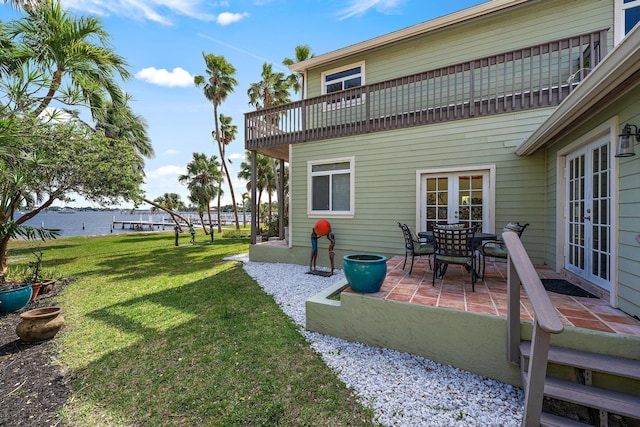 view of yard with french doors and a patio area