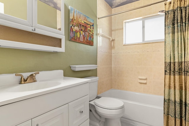 full bath with vanity, toilet, and shower / bath combo with shower curtain