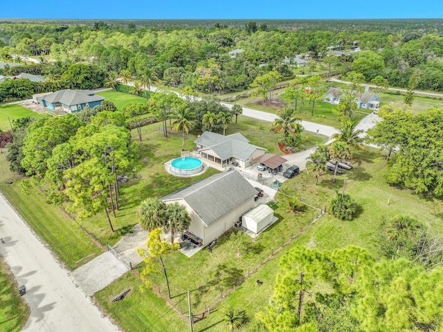 aerial view featuring a wooded view