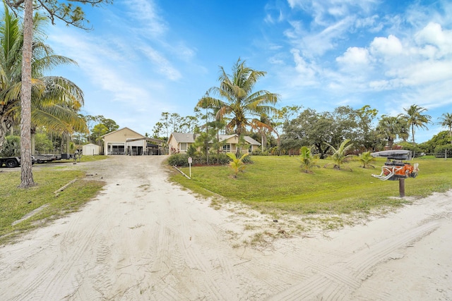 view of street featuring dirt driveway