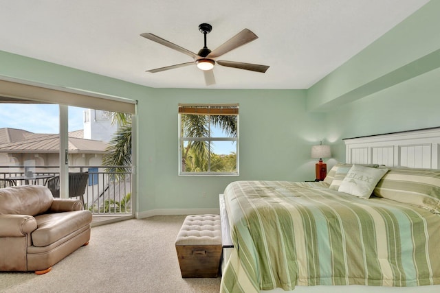 carpeted bedroom featuring baseboards, a ceiling fan, and access to exterior