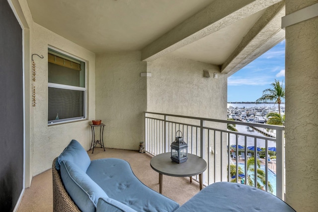 balcony featuring a water view