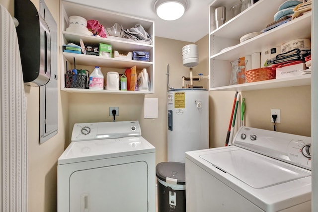 washroom with laundry area, electric water heater, and washing machine and clothes dryer