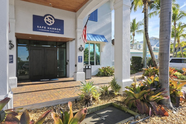 property entrance featuring stucco siding