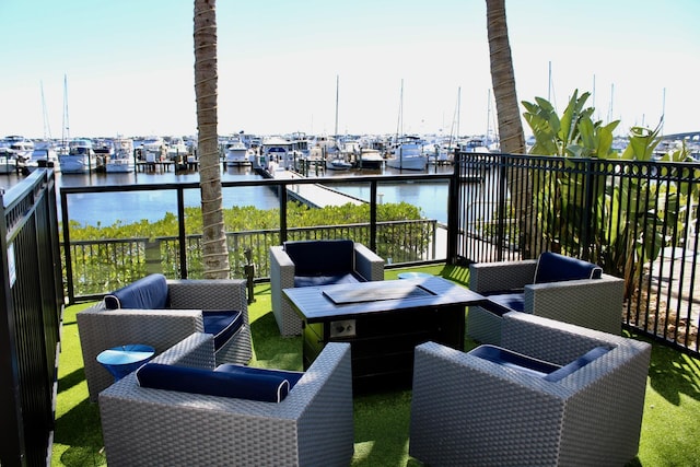 balcony featuring a water view and an outdoor hangout area