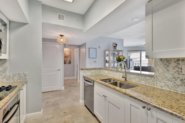 kitchen featuring visible vents, stainless steel dishwasher, wall oven, white cabinets, and a sink