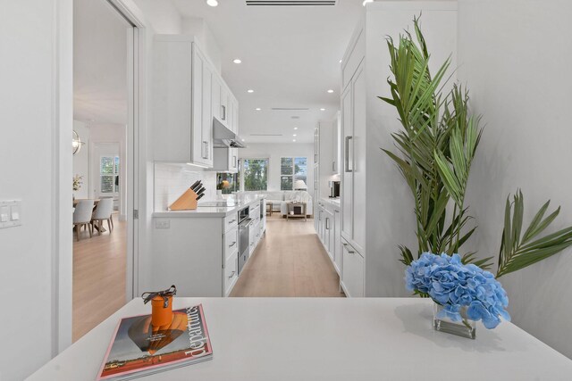 interior space with light wood-type flooring and recessed lighting