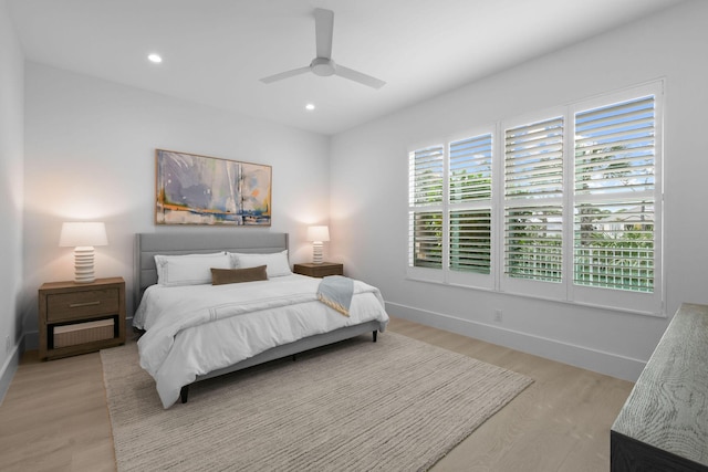 bedroom with a ceiling fan, light wood-type flooring, baseboards, and recessed lighting