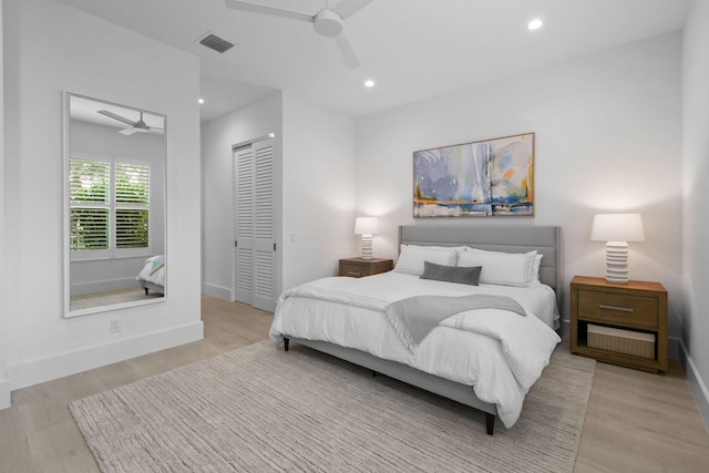 bedroom featuring visible vents, wood finished floors, a closet, and recessed lighting